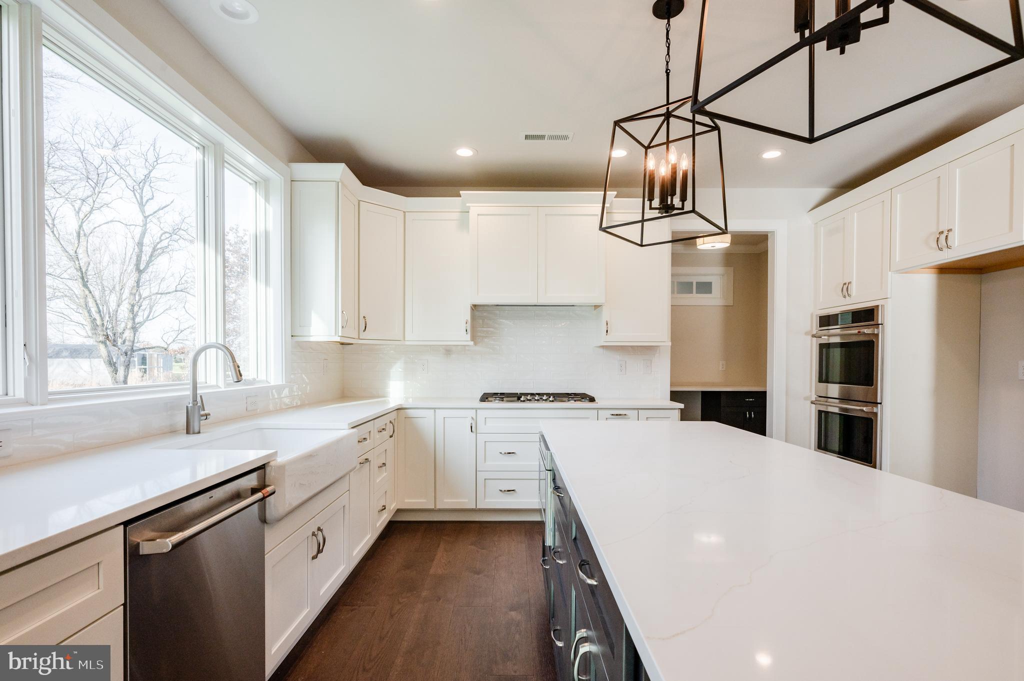 114 Orchard Road Perkasie, PA 18944 - Photo 9 of 17 a kitchen with a sink a counter space appliances and cabinets