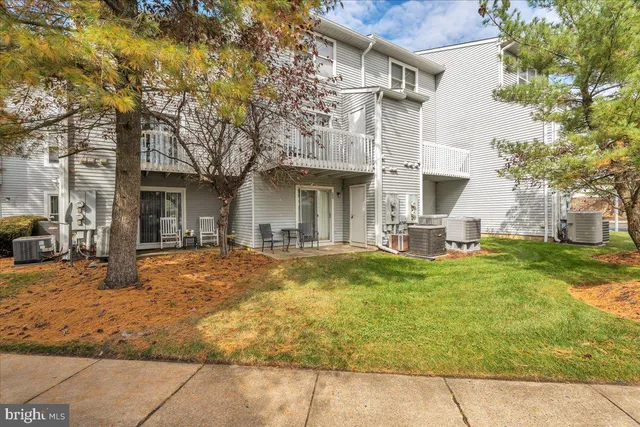 a house view with swimming pool in front of it