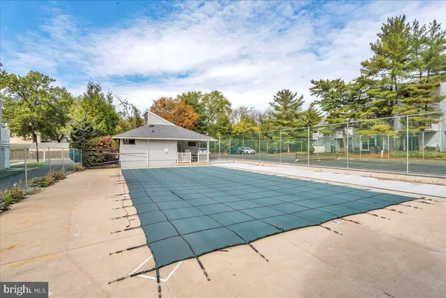 a view of a playground with basketball court