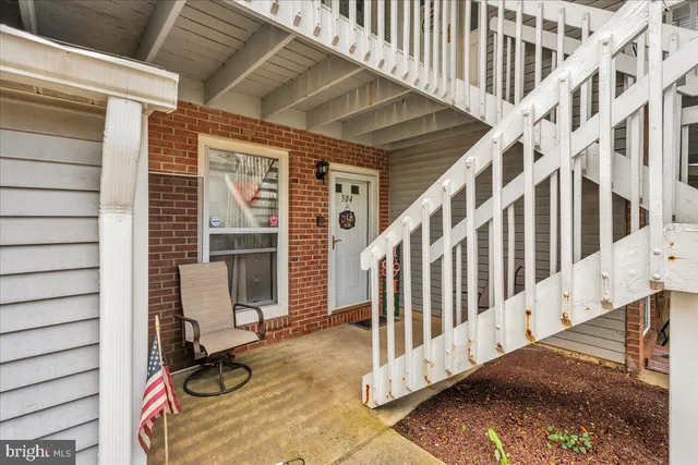 a view of staircase with large windows