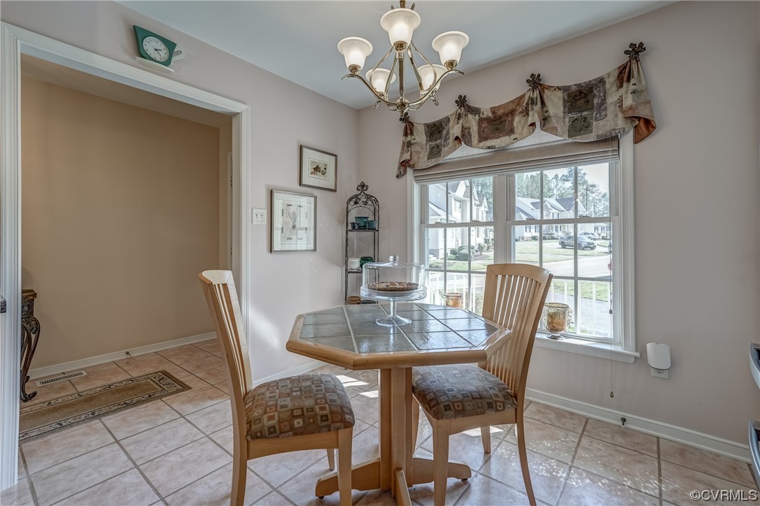 1402 Quiet Lake Loop Midlothian, VA 23114 - Photo 12 of 50 a view of a dining room with furniture window and outside view