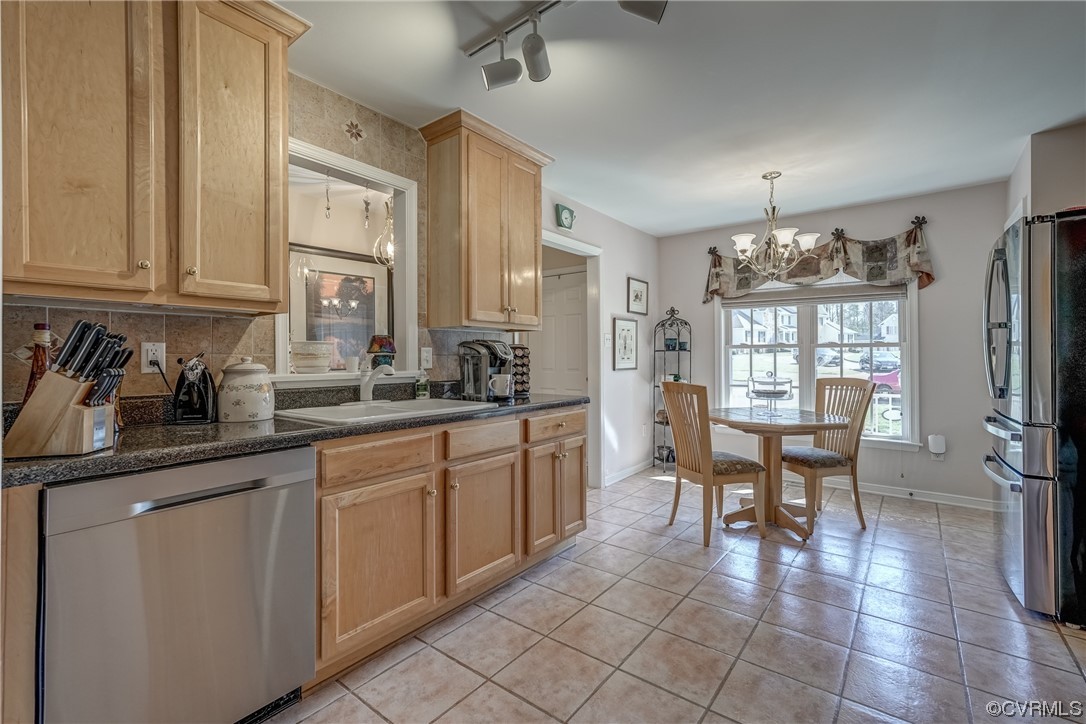 1402 Quiet Lake Loop Midlothian, VA 23114 - Photo 14 of 50 a kitchen with cabinets and chairs