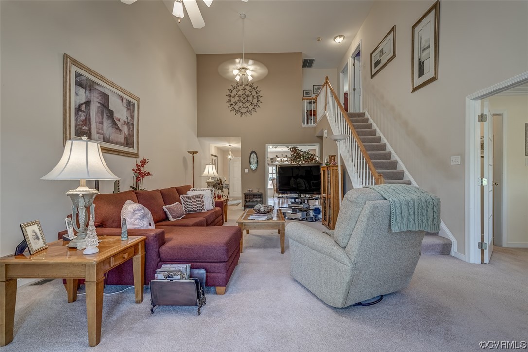 1402 Quiet Lake Loop Midlothian, VA 23114 - Photo 24 of 50 a living room with furniture and a chandelier