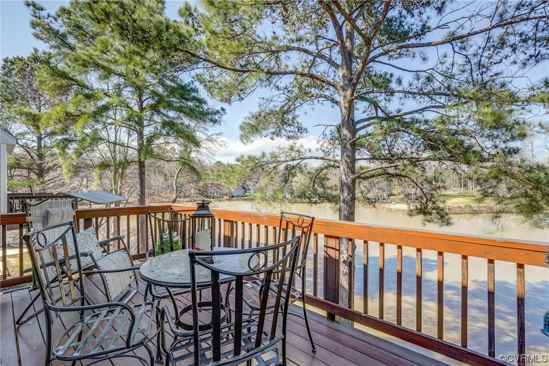 1402 Quiet Lake Loop Midlothian, VA 23114 - Photo 30 of 50 a view of a patio with table and chairs and wooden floor