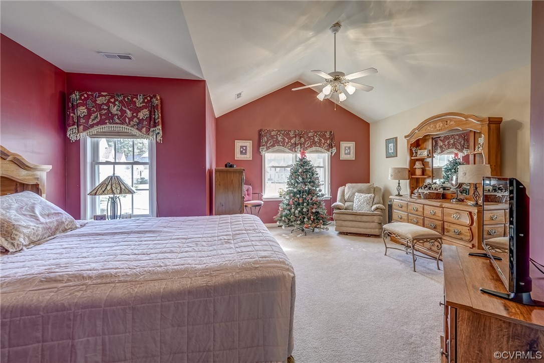 1402 Quiet Lake Loop Midlothian, VA 23114 - Photo 36 of 50 a spacious bedroom with a bed a chandelier and dresser