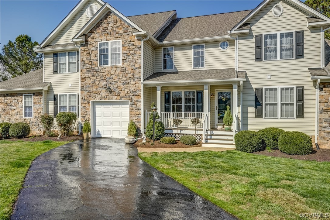 1402 Quiet Lake Loop Midlothian, VA 23114 - Photo 4 of 50 a front view of a house with a yard