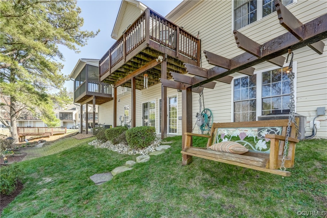 1402 Quiet Lake Loop Midlothian, VA 23114 - Photo 46 of 50 a view of a chair and table in backyard of the house