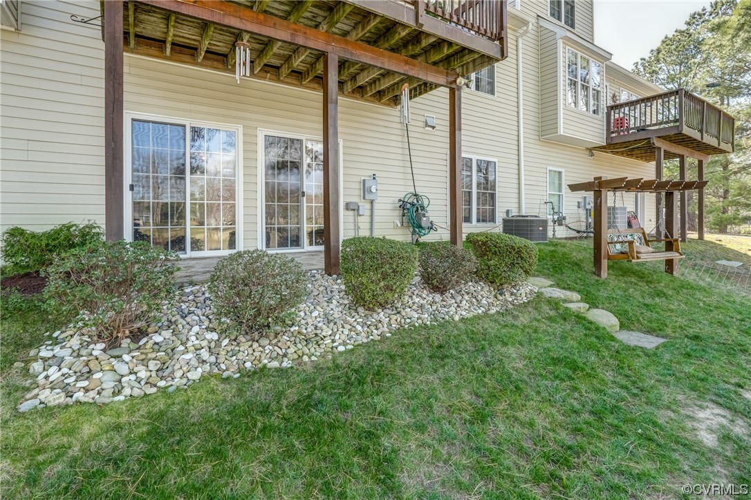 1402 Quiet Lake Loop Midlothian, VA 23114 - Photo 48 of 50 a view of a house with a yard and sitting area