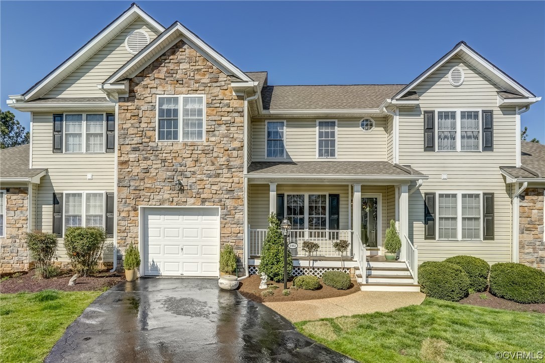 1402 Quiet Lake Loop Midlothian, VA 23114 - Photo 5 of 50 a front view of a house with a yard