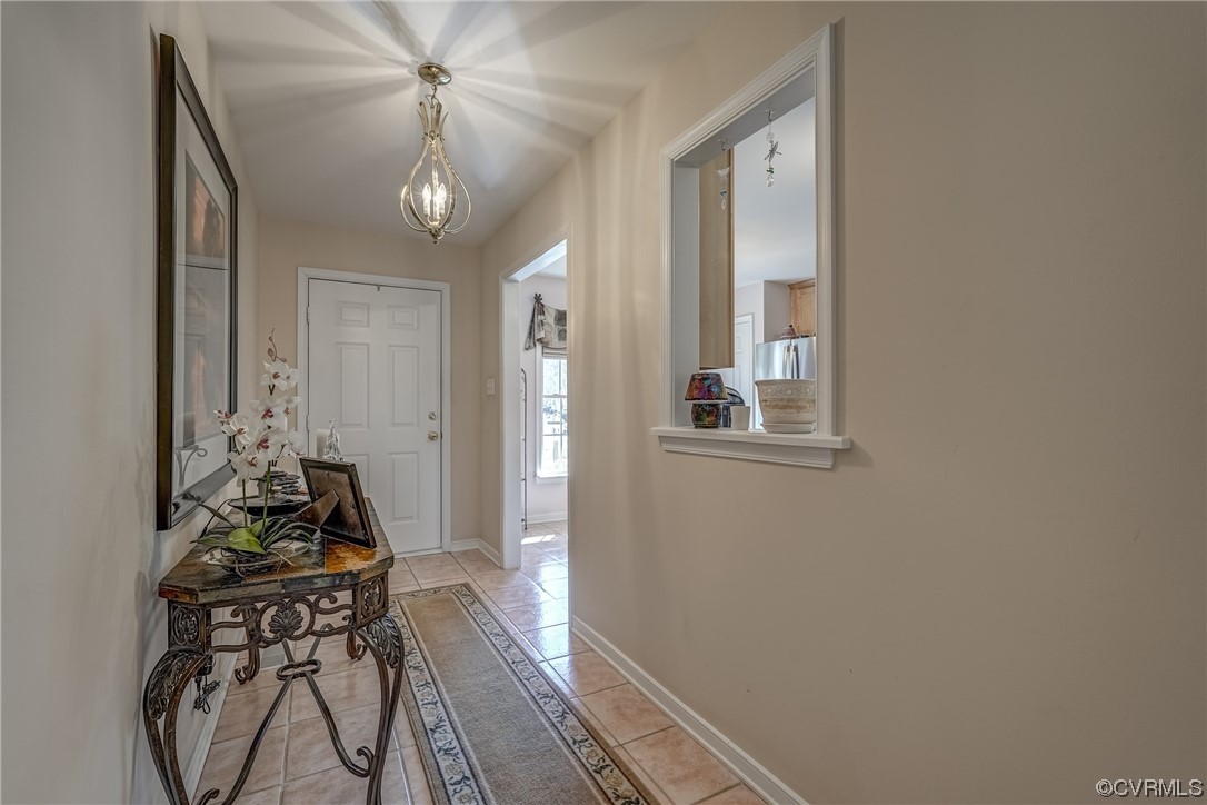 1402 Quiet Lake Loop Midlothian, VA 23114 - Photo 9 of 50 a very nice looking room with wooden floor and a chandelier fan