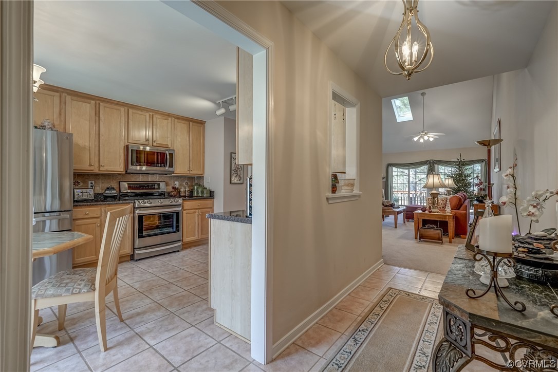 1402 Quiet Lake Loop Midlothian, VA 23114 - Photo 10 of 50 a kitchen with stainless steel appliances granite countertop a stove and a refrigerator