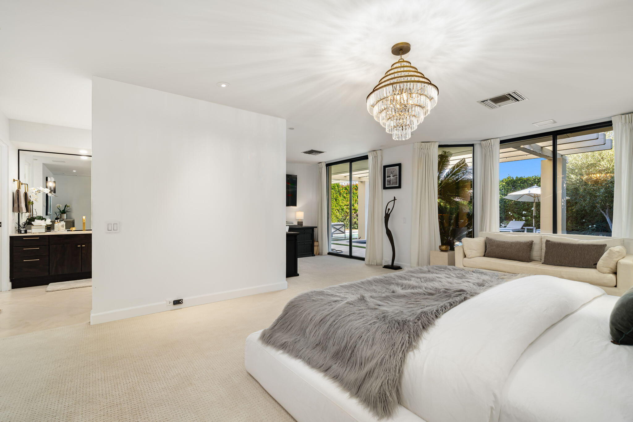 6 Exeter Court Rancho Mirage, CA 92270 - Photo 36 of 54 a spacious bedroom with a bed and a large window