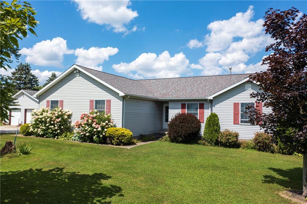 1948 Old State Road Waterford, PA 16441 - Photo 1 of 20 a front view of a house with garden