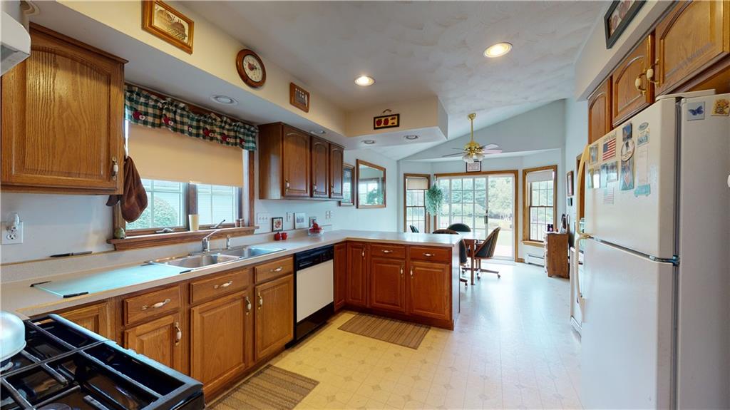1948 Old State Road Waterford, PA 16441 - Photo 11 of 20 a kitchen with stainless steel appliances granite countertop a sink stove and refrigerator