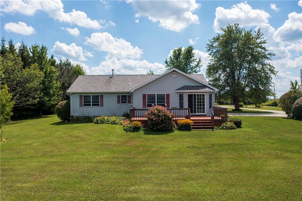 1948 Old State Road Waterford, PA 16441 - Photo 3 of 20 a front view of a house with a garden and trees