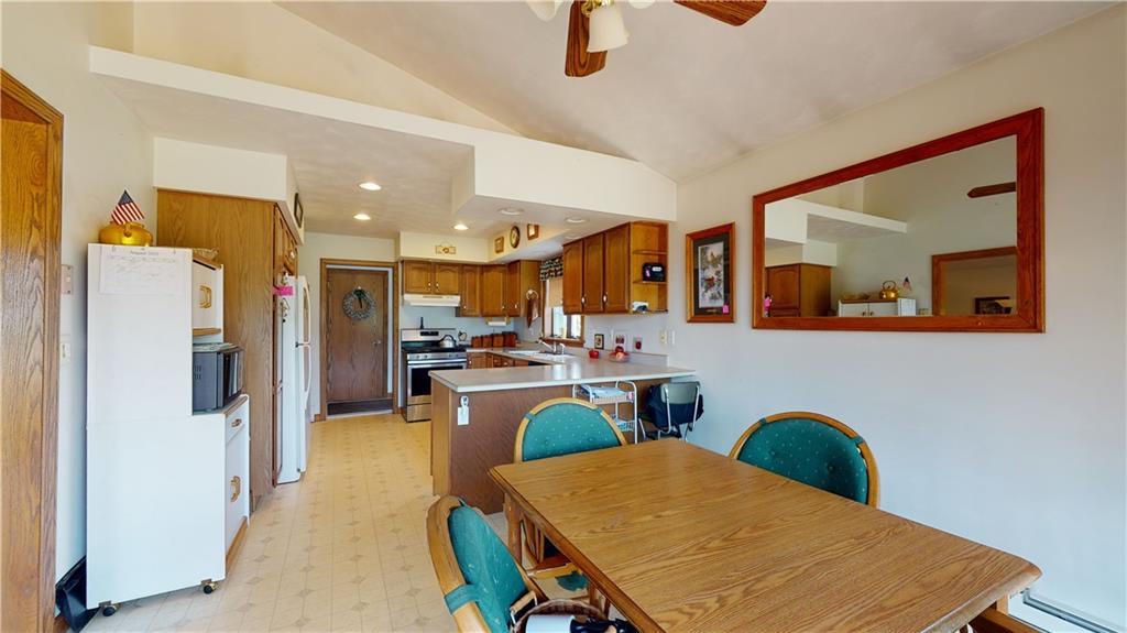 1948 Old State Road Waterford, PA 16441 - Photo 9 of 20 a view of a dining room kitchen with furniture and a kitchen view