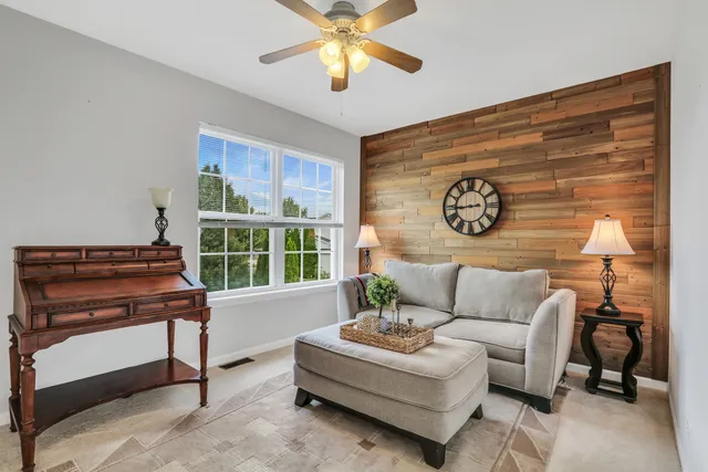 a living room with furniture and a window