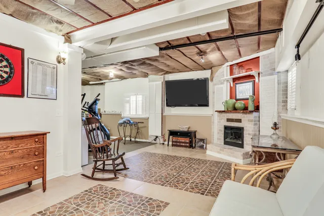 a view of a livingroom with furniture and a flat screen tv