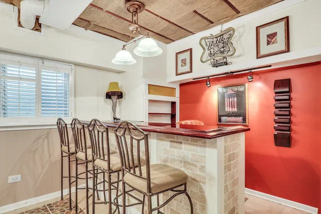 a view of a chairs and a table in a balcony