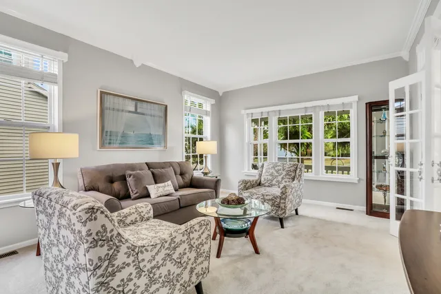 a living room with furniture and a lamp