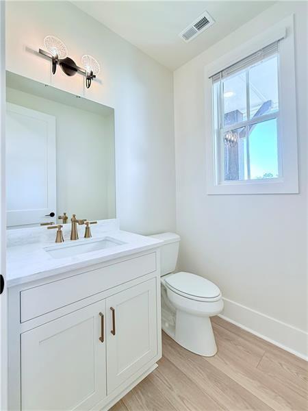122 Palisade Drive Rydal, GA 30171 - Photo 24 of 54 a bathroom with a toilet sink and mirror