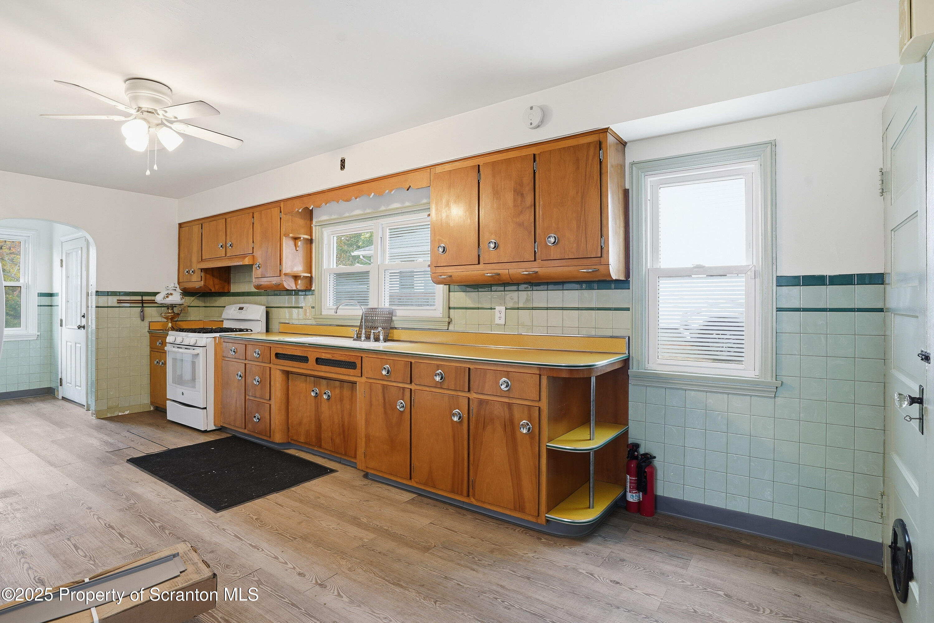 123 William Street Scranton, PA 18510 - Photo 12 of 25 a kitchen with stainless steel appliances granite countertop a stove a sink dishwasher and a refrigerator