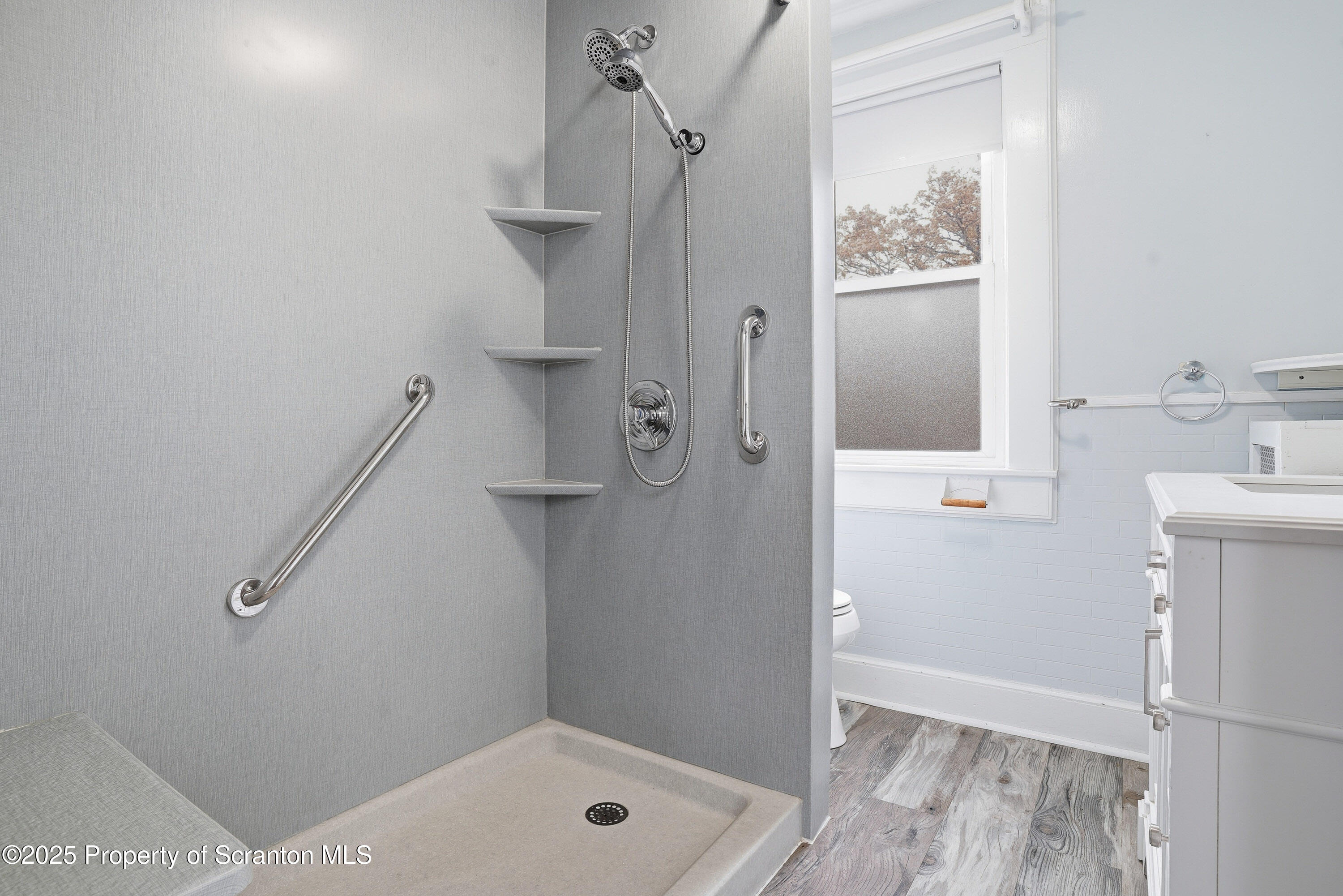 123 William Street Scranton, PA 18510 - Photo 15 of 25 a bathroom with a shower and a sink