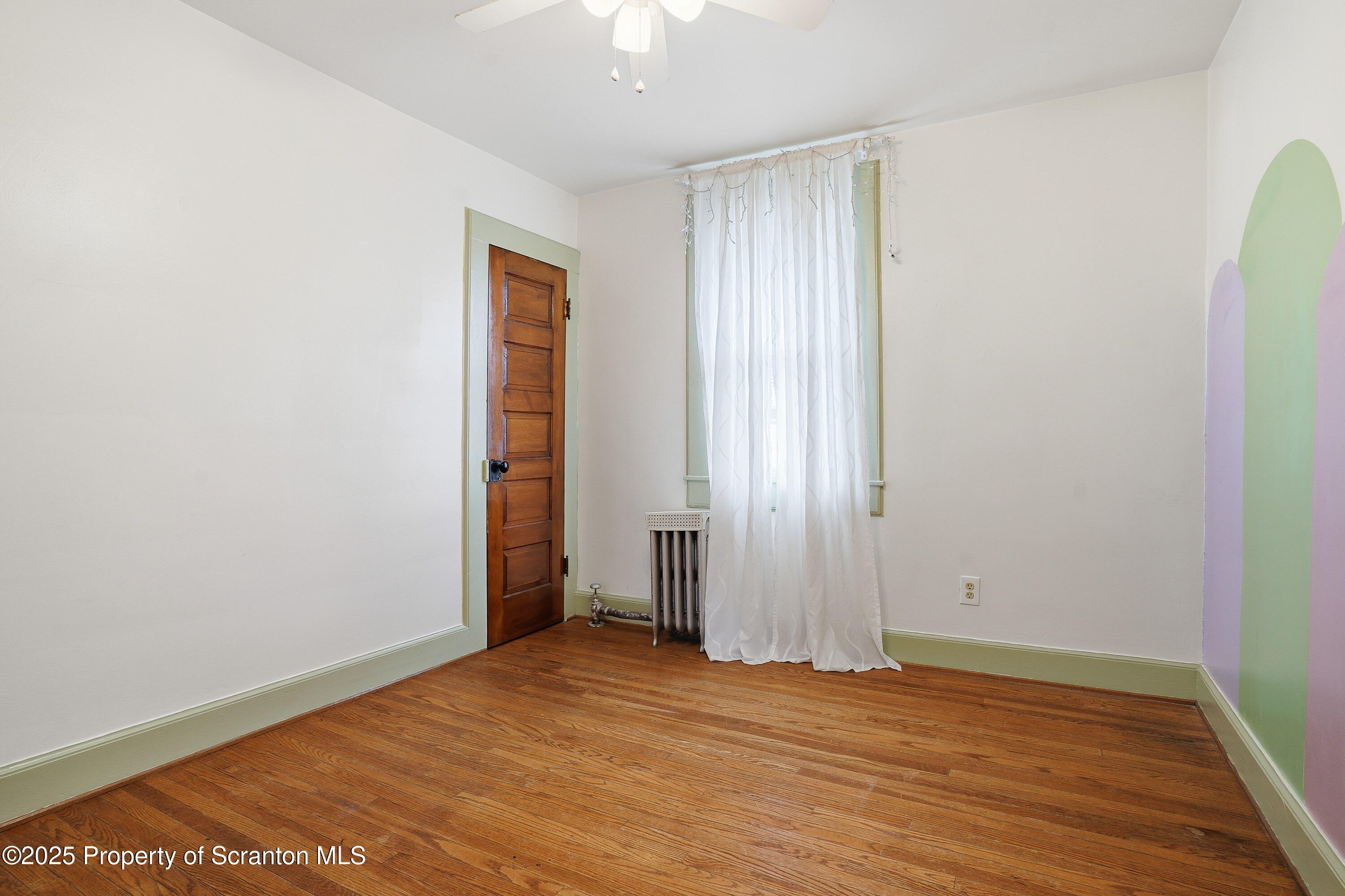 123 William Street Scranton, PA 18510 - Photo 17 of 25 an empty room with wooden floor and closet