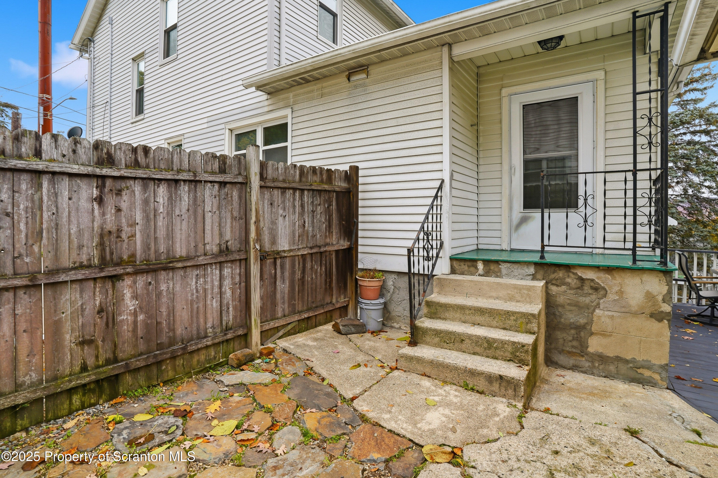 123 William Street Scranton, PA 18510 - Photo 20 of 25 a view of a backyard with a wooden fence