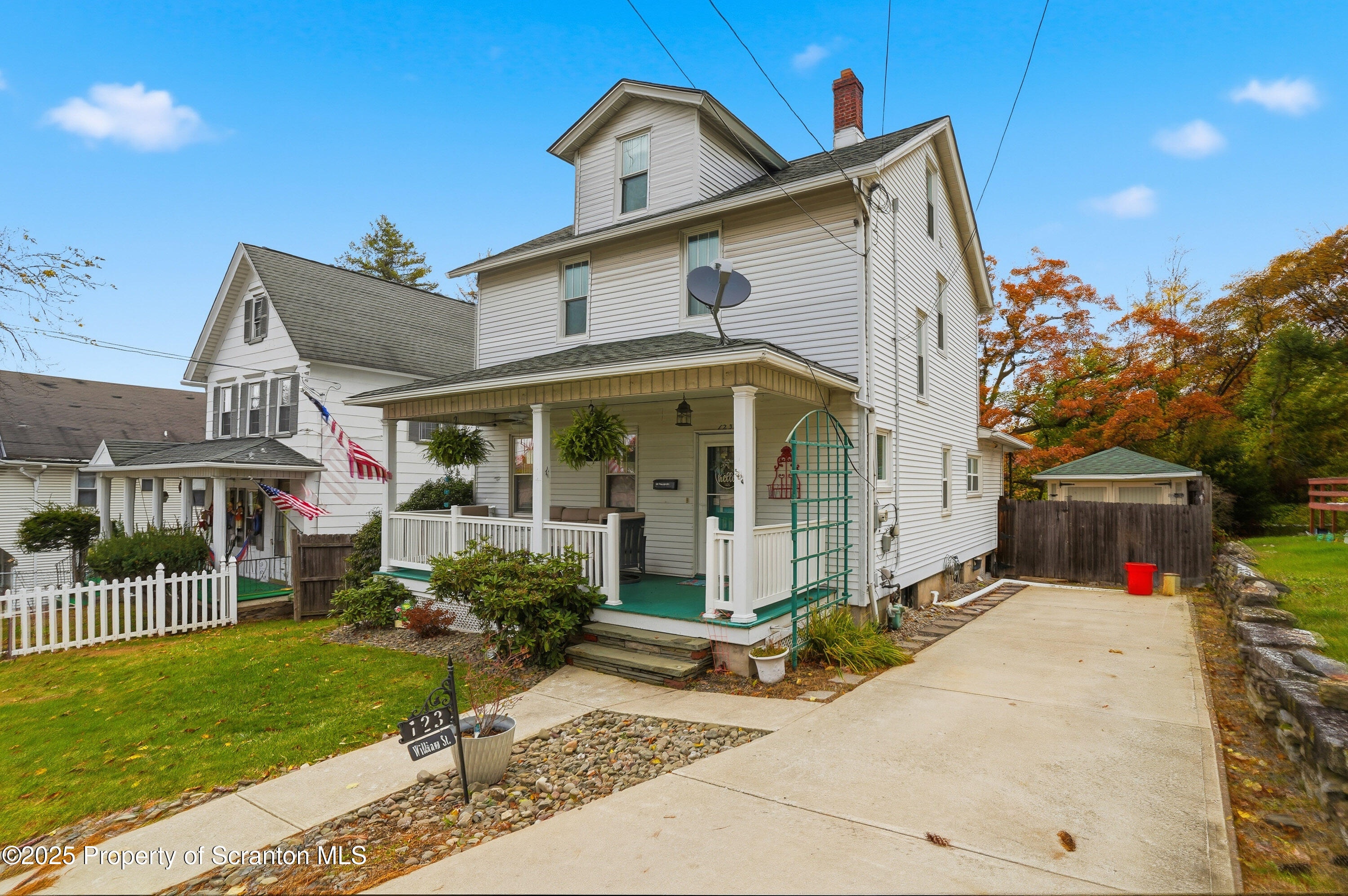 123 William Street Scranton, PA 18510 - Photo 3 of 25 a front view of a house with a yard