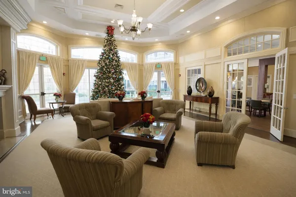 a view of a dining room with furniture and a window
