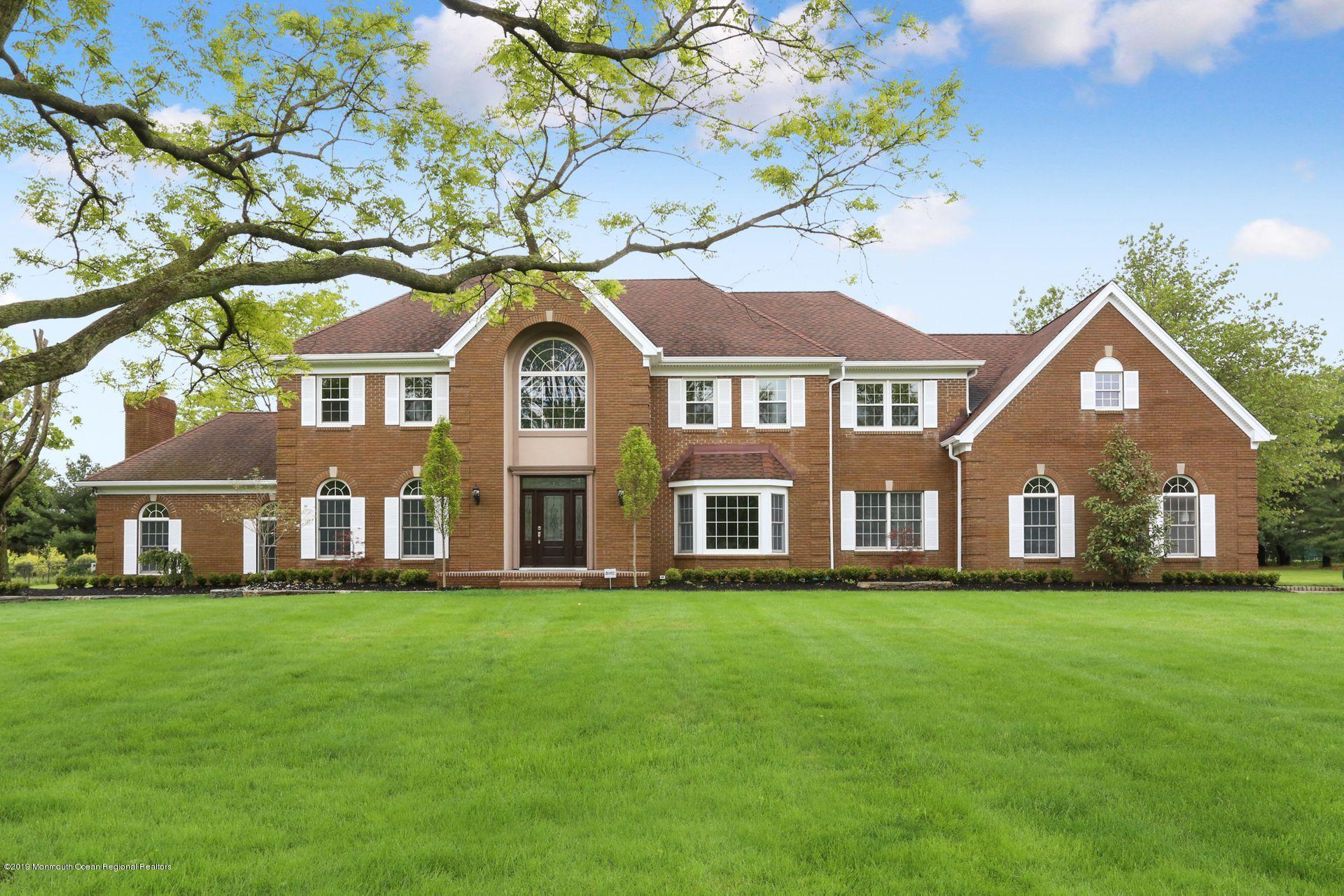 7 Pheasant Road Colts Neck, NJ 07722 - Photo 3 of 50 a front view of a house with a garden