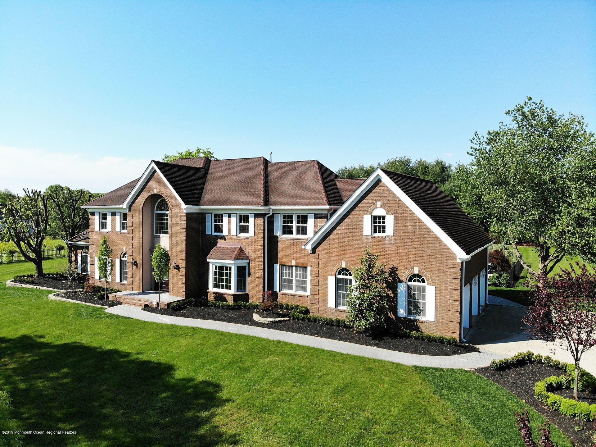 7 Pheasant Road Colts Neck, NJ 07722 - Photo 50 of 50 a front view of house with yard and green space