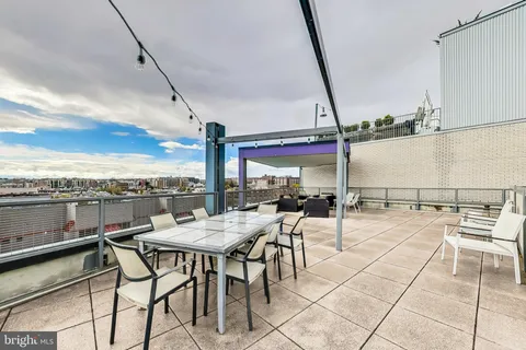 a view of a terrace with furniture and sitting area