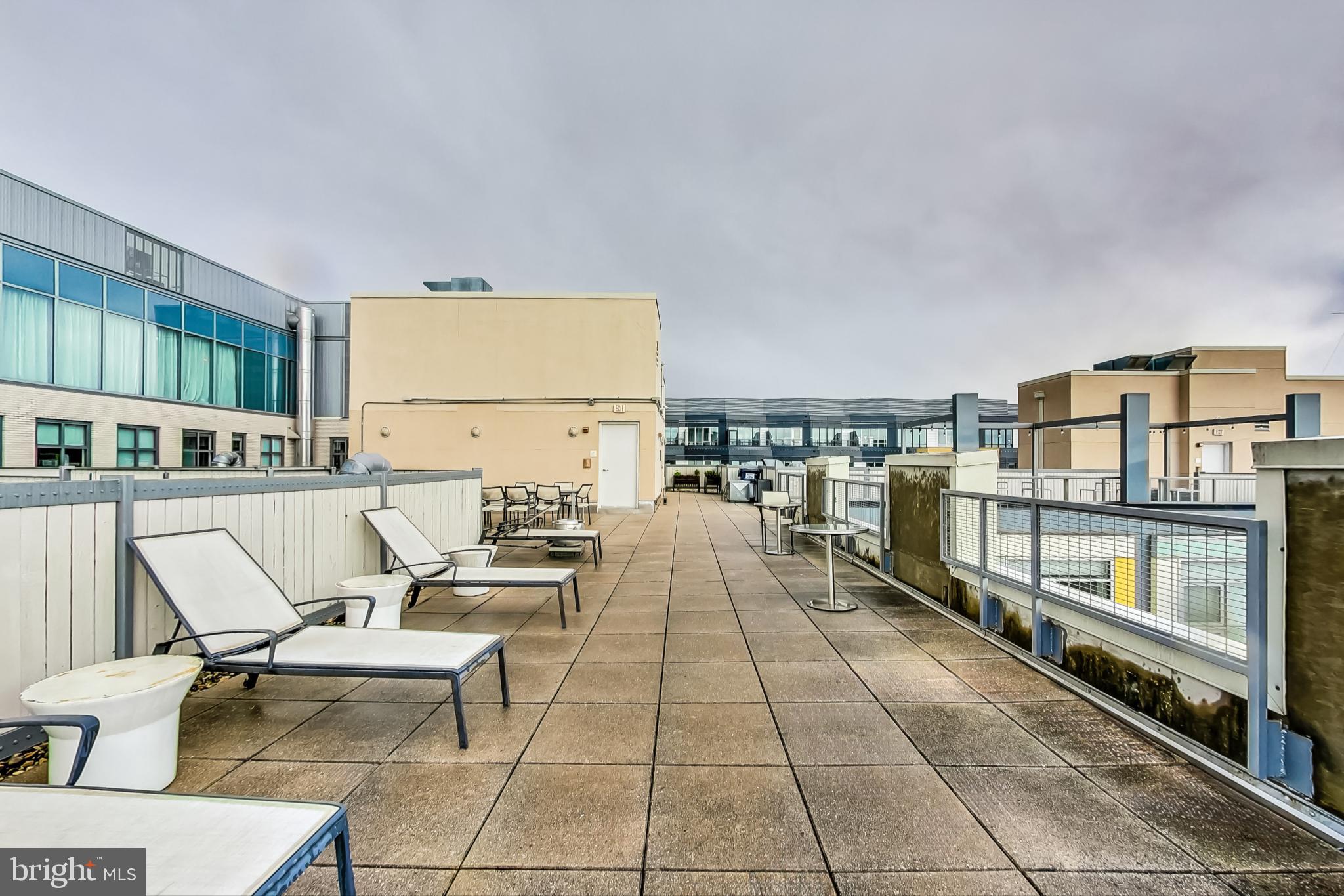 929 Florida Avenue Northwest, Unit 4008 Washington, DC 20001 - Photo 26 of 33 a living room with chairs and a table