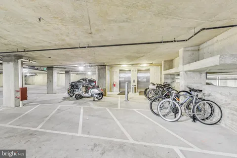 a view of a garage with parked cars