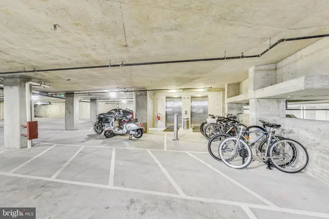 a view of a garage with parked cars