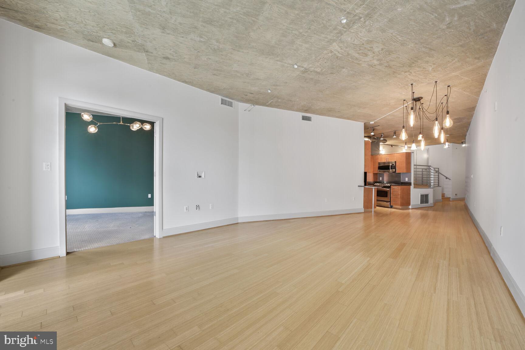 929 Florida Avenue Northwest, Unit 4008 Washington, DC 20001 - Photo 4 of 33 a view of a room with wooden floor