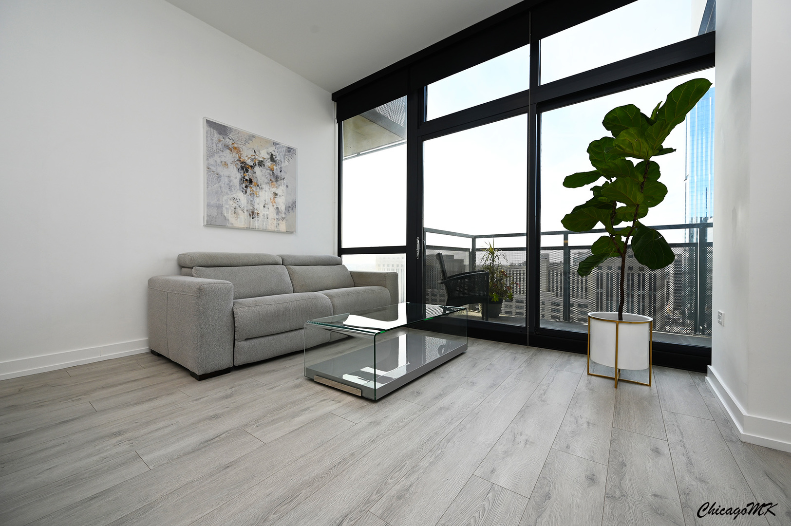 235 West Van Buren Street, Unit 2213 Chicago, IL 60607 - Photo 2 of 31 a living room with furniture and a large window