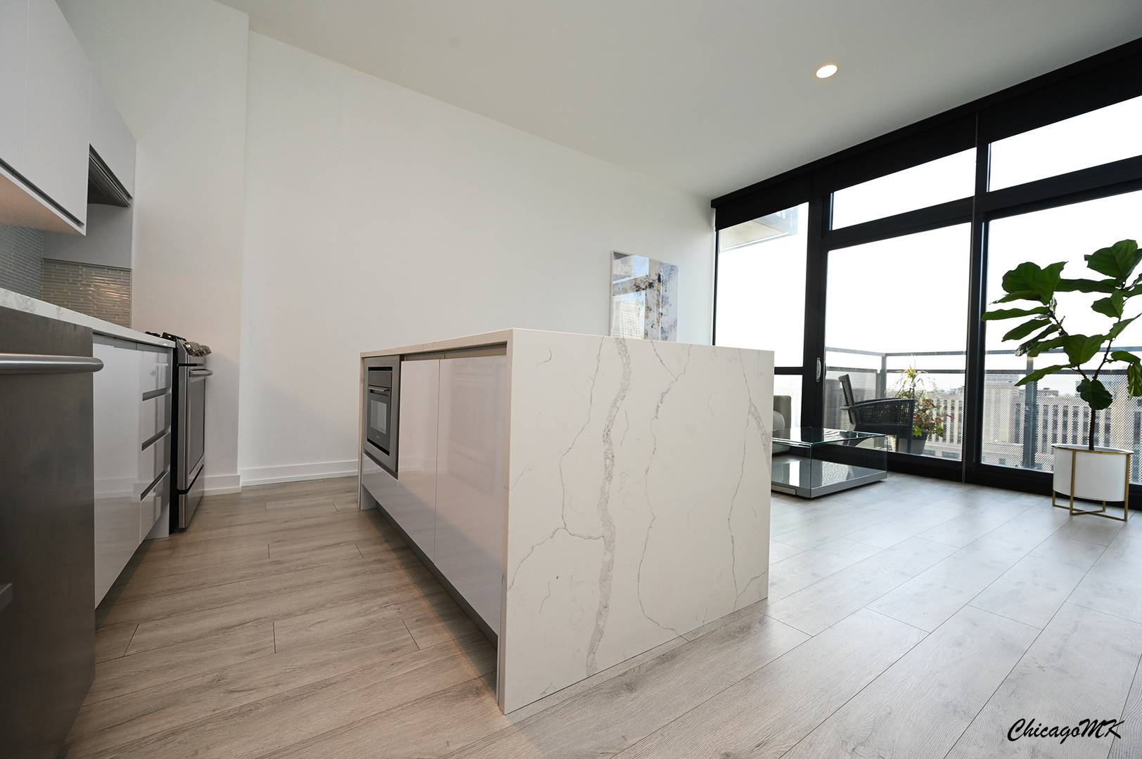 235 West Van Buren Street, Unit 2213 Chicago, IL 60607 - Photo 13 of 31 a view of a livingroom with furniture and a refrigerator
