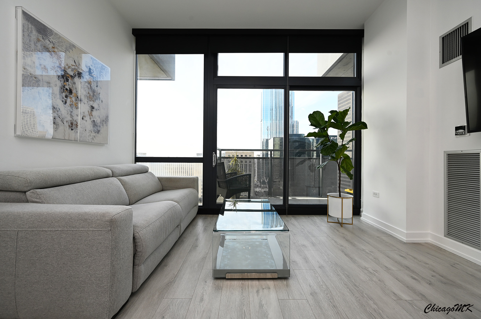 235 West Van Buren Street, Unit 2213 Chicago, IL 60607 - Photo 3 of 31 a living room with furniture and a large window