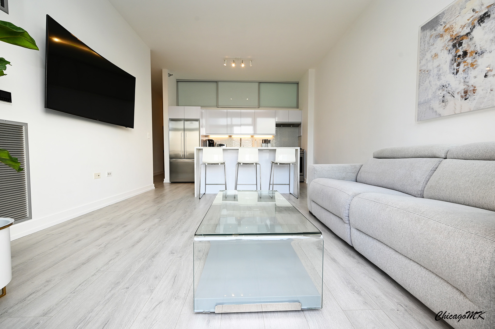 235 West Van Buren Street, Unit 2213 Chicago, IL 60607 - Photo 5 of 31 a living room with furniture and a flat screen tv