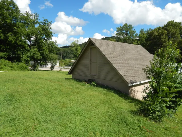 a backyard of a house with lots of green space