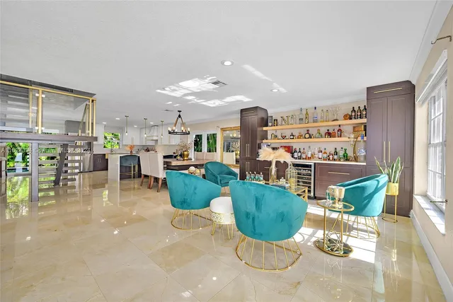 a living room with lots of furniture and a chandelier