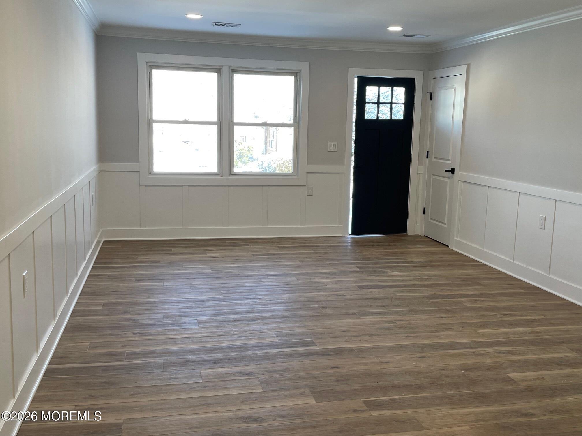14 Churchill Road, Unit 71 Whiting, NJ 08759 - Photo 4 of 18 wooden floor in an empty room with a window