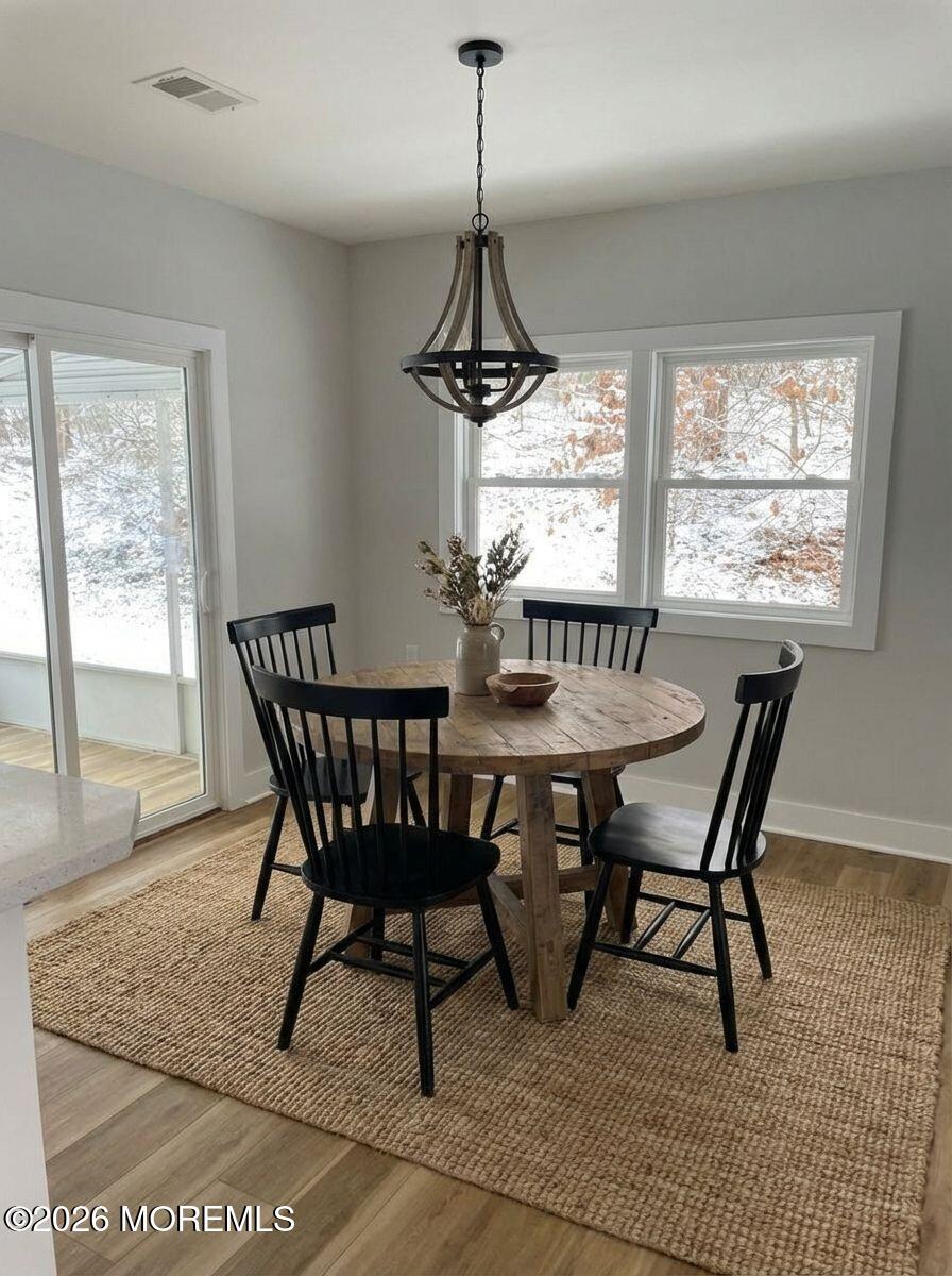 14 Churchill Road, Unit 71 Whiting, NJ 08759 - Photo 9 of 18 a dining room with furniture window wooden floor