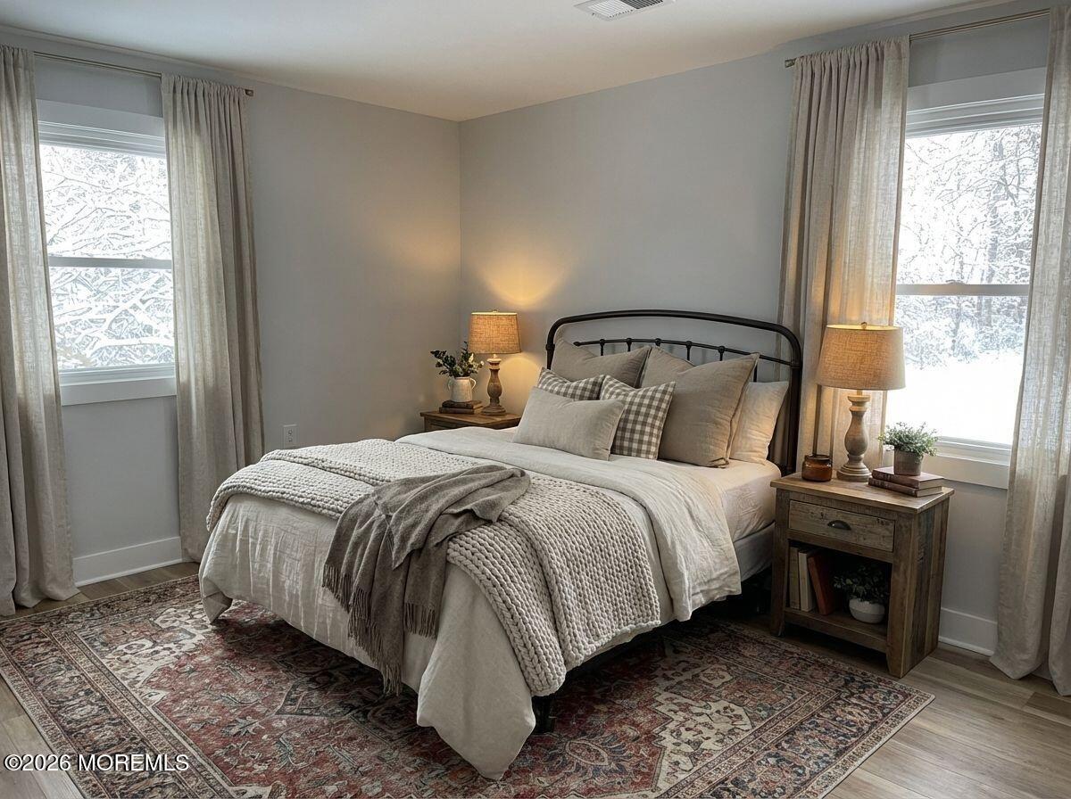 14 Churchill Road, Unit 71 Whiting, NJ 08759 - Photo 10 of 18 a bedroom with a bed and a window