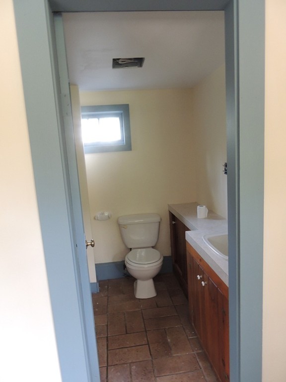 400 Lower Hampden Road Monson, MA 01057 - Photo 11 of 30 a bathroom with a granite countertop toilet and a sink