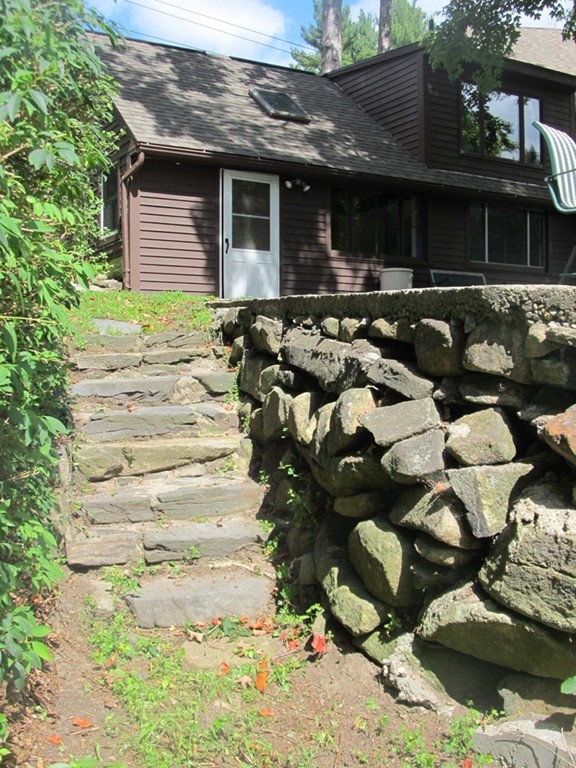 400 Lower Hampden Road Monson, MA 01057 - Photo 3 of 30 a front view of a house with a yard