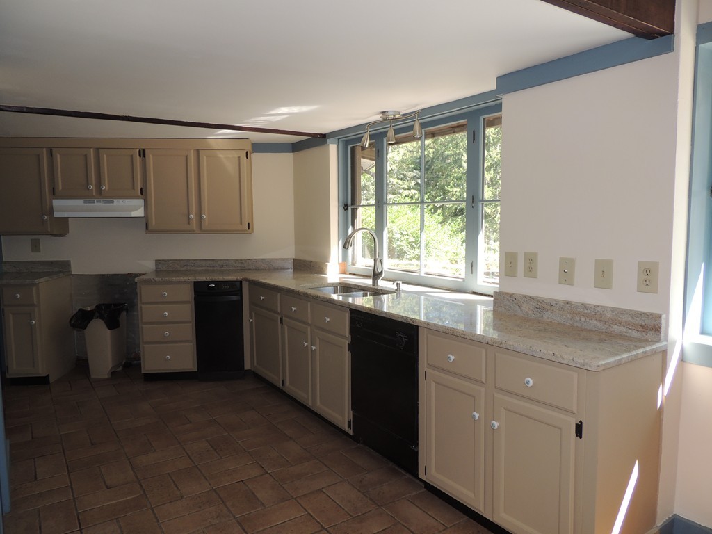 400 Lower Hampden Road Monson, MA 01057 - Photo 9 of 30 a kitchen with a sink stove and cabinets